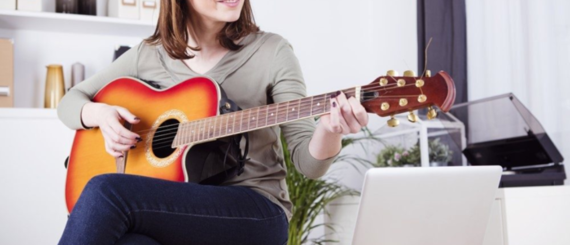 Woman learning guitar